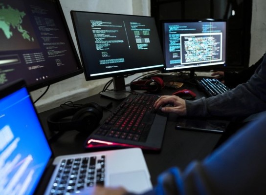 Person working on a cyber crime investigation on their computer