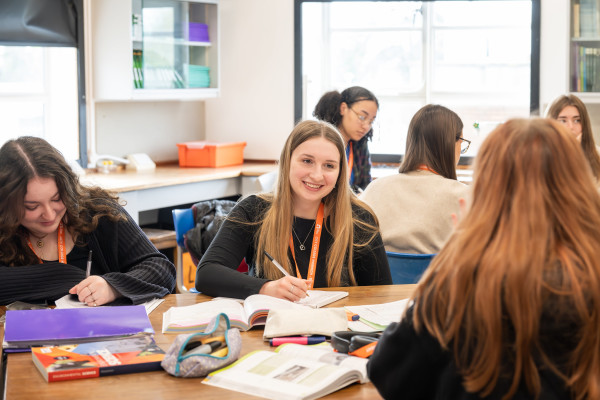 Smiling A Level student at desk