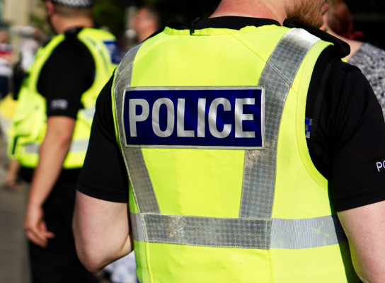 Police Officer working amongst public