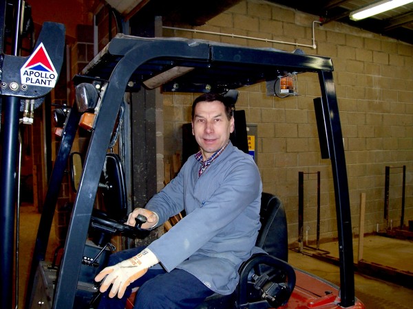 Brian driving a new forklift truck purchased for the construction department  around 2002.