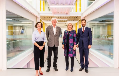 Four adults attending the Digitech building opening