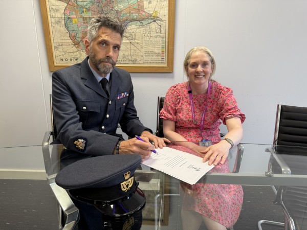 Hospitality and Catering lecturer, and RAF Reservist, Bob Oberhoffer, and Chief Operating Officer, Jen Eves, signing the Armed Forces Covenant on behalf of the college.