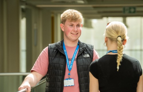 Student Union President Lewis talking to another student