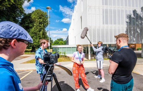 Film students work outside the DigiTech building