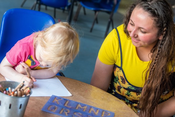 A child drawing at the college nursery.