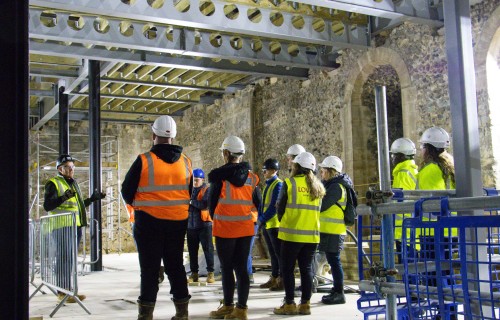 Students seeing first hand the progress that has been made in constructing floors within the castle keep