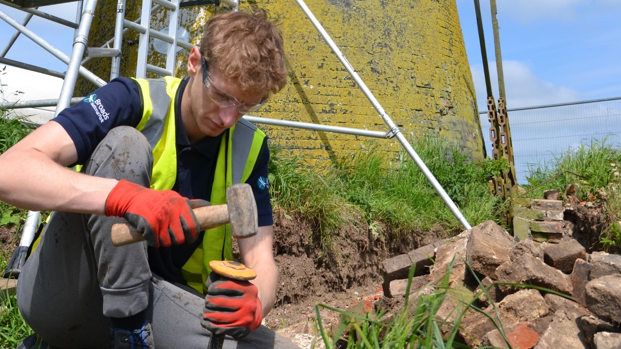 Broads Authority apprentice Brandon Jarvis working on the current restoration project at Highs Mill